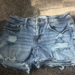 BKE Women's Low rise Stella Distressed Denim Jean Shorts in Light Blue Wash